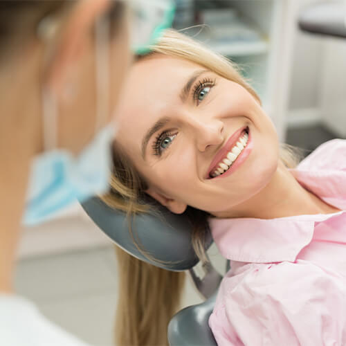 A new patient reclining in a dental chair